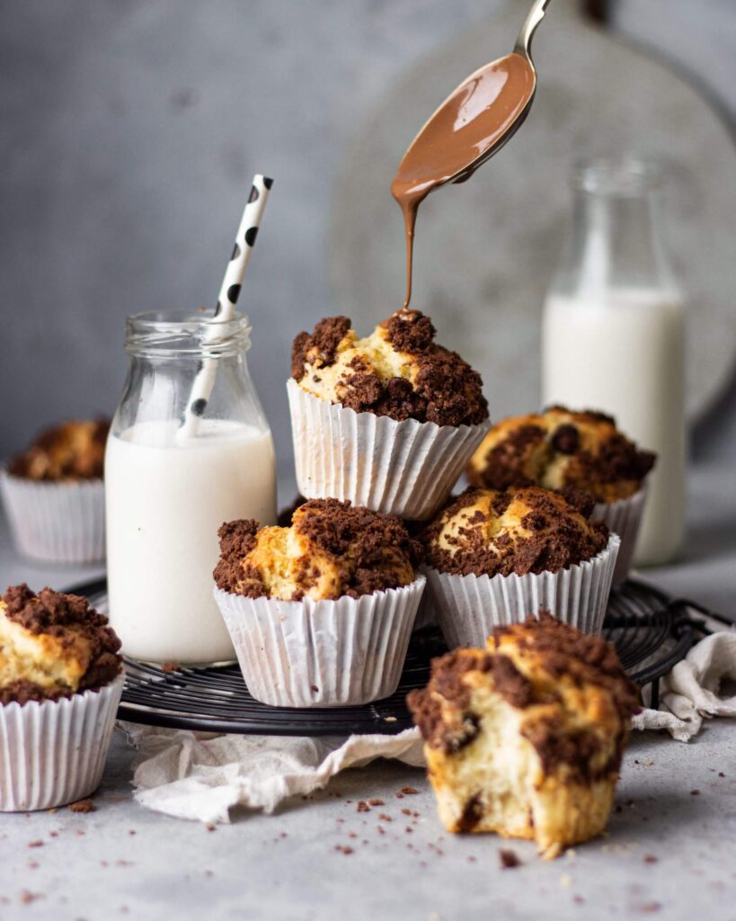 Topping chocolate muffins with chocolate chips